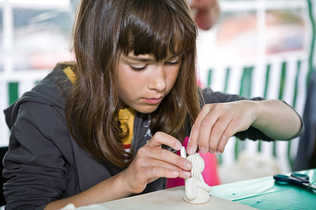 girl shaping clay