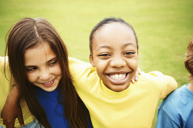 girls smiling on field