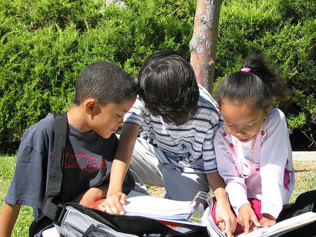 kids reading outside